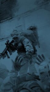 combat soldier helping fallen team mate